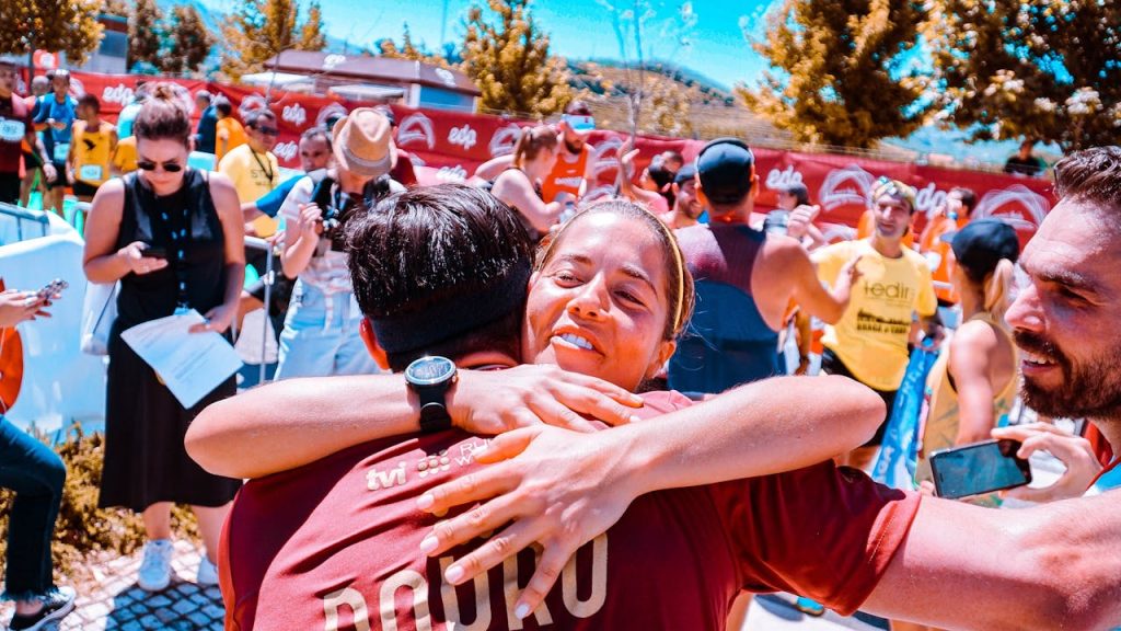 woman-hugging-man-at-middle-of-field-2403256 A vibrant scene of happiness and community at an outdoor event.